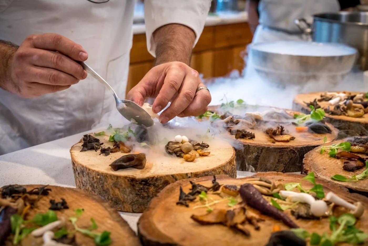Chef finishing plates of food before service