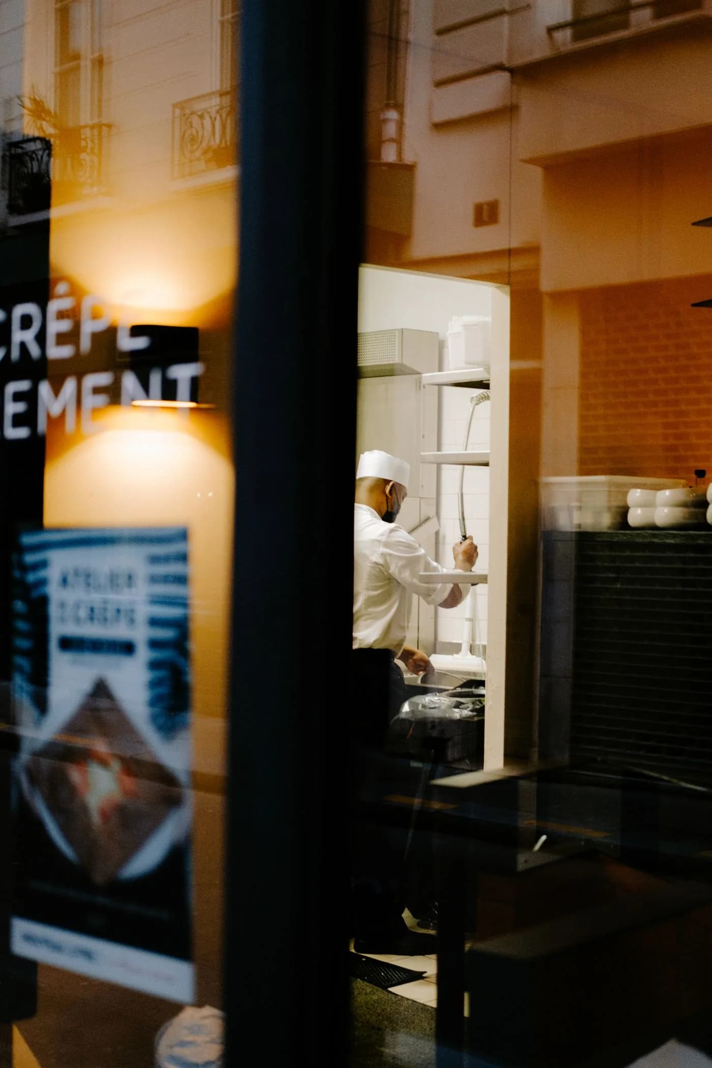 Chef working inside a restaurant kitchen